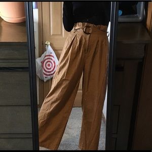 I’m selling an orangey tan, brown pants that are straight legged with belt